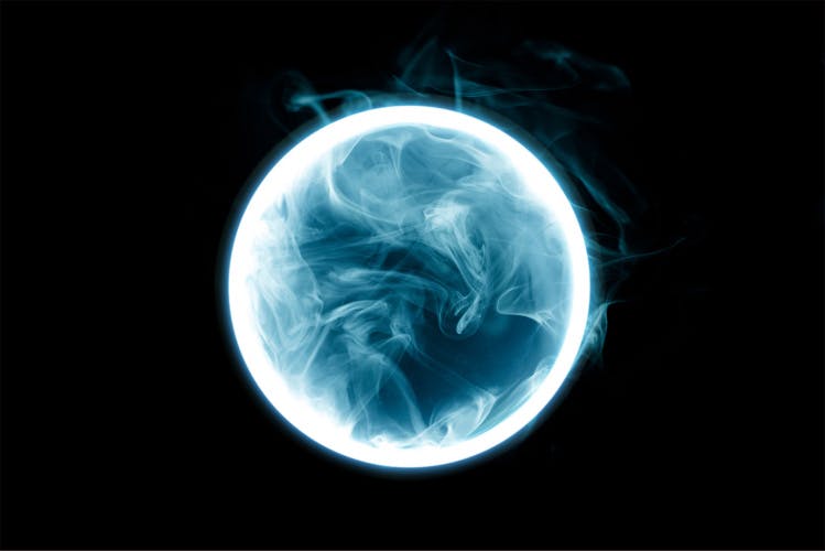 Smokey neon circle on a dark background