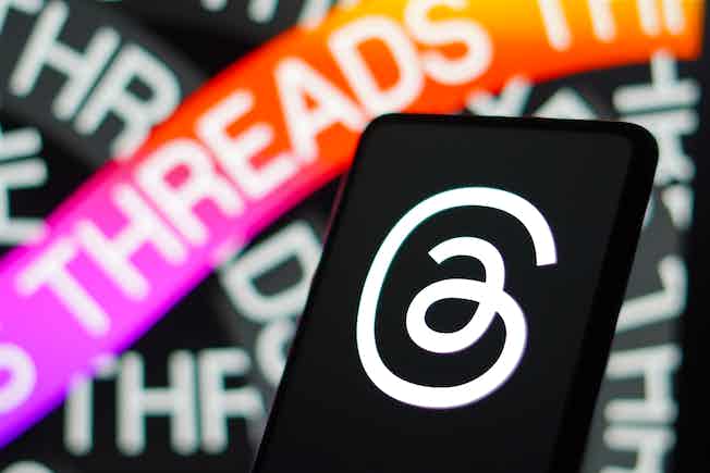 threads logo on phone